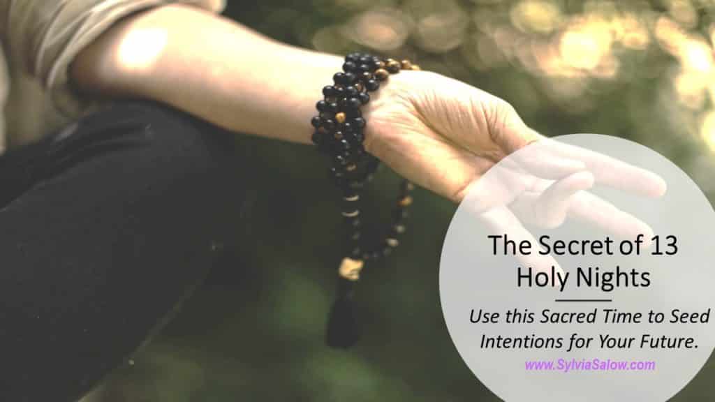 woman meditating in nature with mala beads necklace